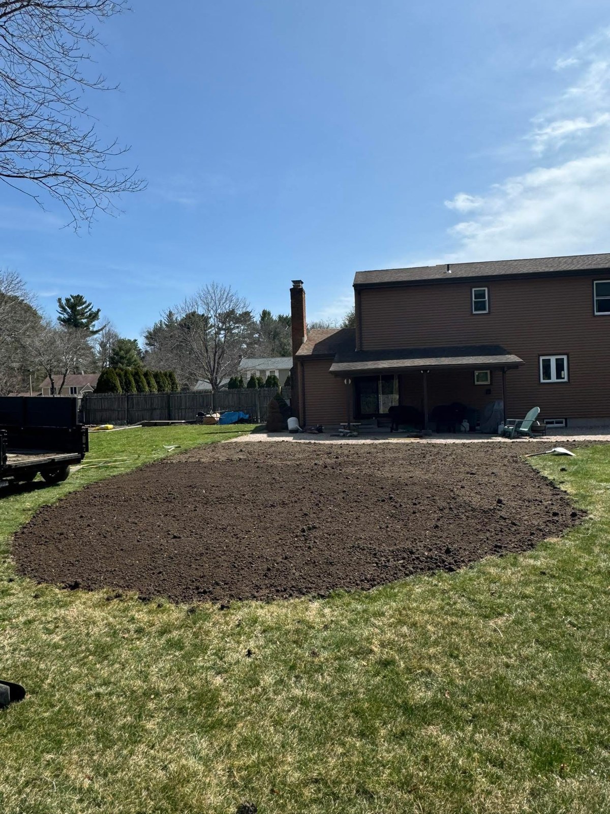 Backyard area after new soil was spread